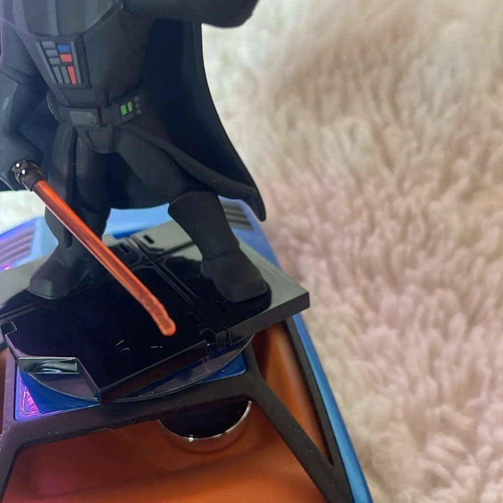 Darth Vader Figure on Blue Car
